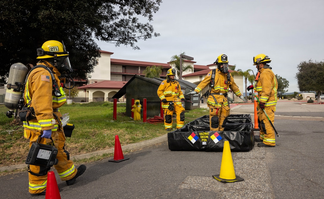 Members of the Camp Pendleton Fire Department practice hazmat decontamination in a hazmat training exercise during Command Post Exercise II at Marine Corps Base Camp Pendleton, California, Jan. 28, 2026. CPX II combined the efforts of various agencies across MCIWEST to exercise staff actions in response to a simulated food supply contamination, including verifying the safety and security of food sources, assessing the impact of food delivery interruptions, identifying response actions to restore safe food deliveries, and exercising the Camp Pendleton Fire Department’s procedures for hazardous materials incidents. (U.S. Marine Corps photo by Cpl. Jacqueline Akamelu)