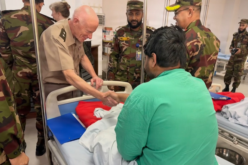 U.S. Army Maj. Gen. E. Darrin Cox, 18th Theater Medical Command commander, speaks with a patient at the Jalalabad Cantonment and Combined Military Hospital in Sylhet, Bangladesh, Jan. 21, 2026.