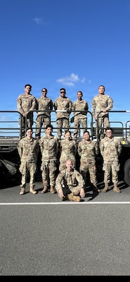 Airmen assigned to the 48th Aerial Port Squadron pose for a group photo at Joint Base Pearl Harbor-Hickam, Hawaii, Nov. 13, 2025.