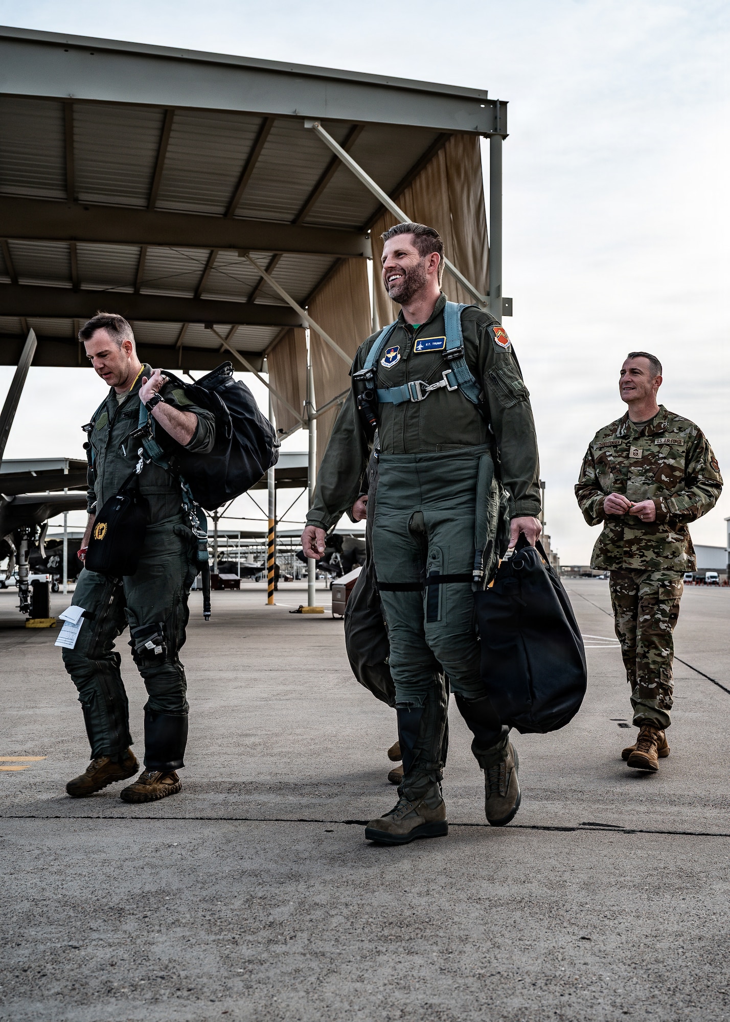 Pilots from the 49th Fighter Wing and 56th Fighter Wing, step to their jets as Mr. Eric Trump receives an overview of 4th and 5th generation fighter jet integration, Jan. 29, 2026, at Luke Air Force Base, Arizona. This up-close view reinforced the importance of training, readiness, and interoperability in maintaining dominance and superiority in the air. (U.S. Air Force photo by Airman 1st Class Belinda Guachun-Chichay)