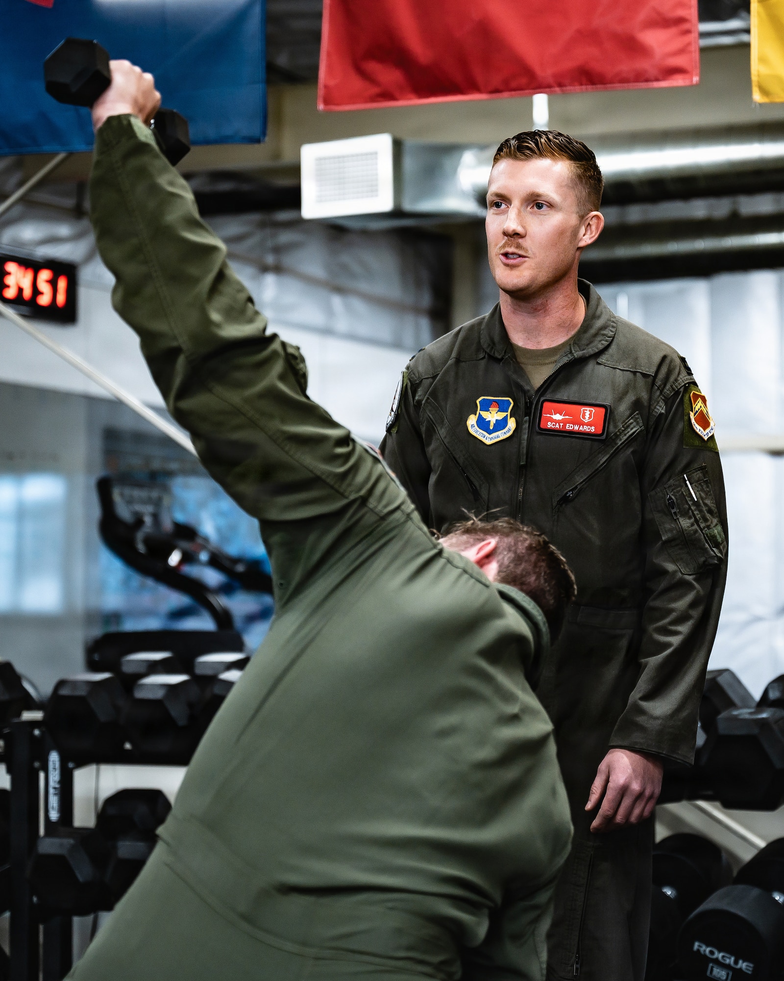 U.S. Air Force Capt. William Edwards, 56th Fighter Wing human performance team element chief, briefs Mr. Eric Trump inside the Tactical Integrated Training and Assessment Nexus, Jan. 29, 2026, at Luke Air Force Base, Arizona. TITAN provides specialized training and performance optimization to develop resilient, mission-ready fighter pilots capable of operating in high-end combat environments. (U.S. Air Force photo by Airman 1st Class Belinda Guachun-Chichay)
