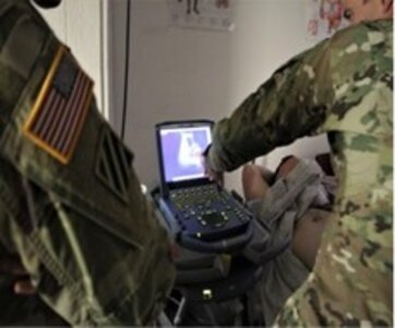 Military medical personnel participate in a familiarization and validation demonstration of the AI-GUIDE system at the Fort Bliss Medical Simulation Center in El Paso, Texas