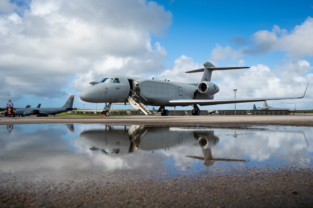 A mission crew boards a U.S. Air Force EA-37B Compass Call at Andersen Air Force Base, Guam, Dec. 7, 2025. Teams from the USAF and the Royal Australian Air Force trained together on an EA-37B in preparation for the RAAF receiving its own version of a Gulfstream-based special mission support aircraft. (U.S. Air Force courtesy photo)