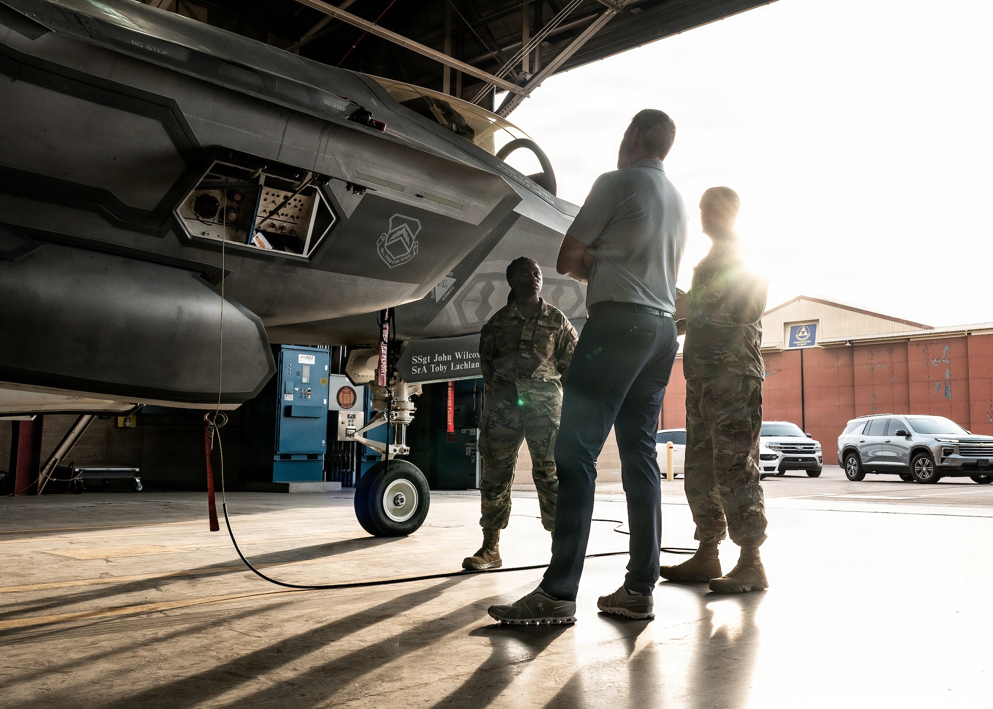 U.S. Air Force Airmen assigned to the 310th Maintenance Unit, responsible for maintaining F-35A Lightning II operations, explain to Mr. Eric Trump fifth-generation capabilities as he met with them during his visit, Jan. 28, 2026, at Luke Air Force Base, Arizona. (U.S. Air Force photo by Airman 1st Class Belinda Guachun-Chichay)