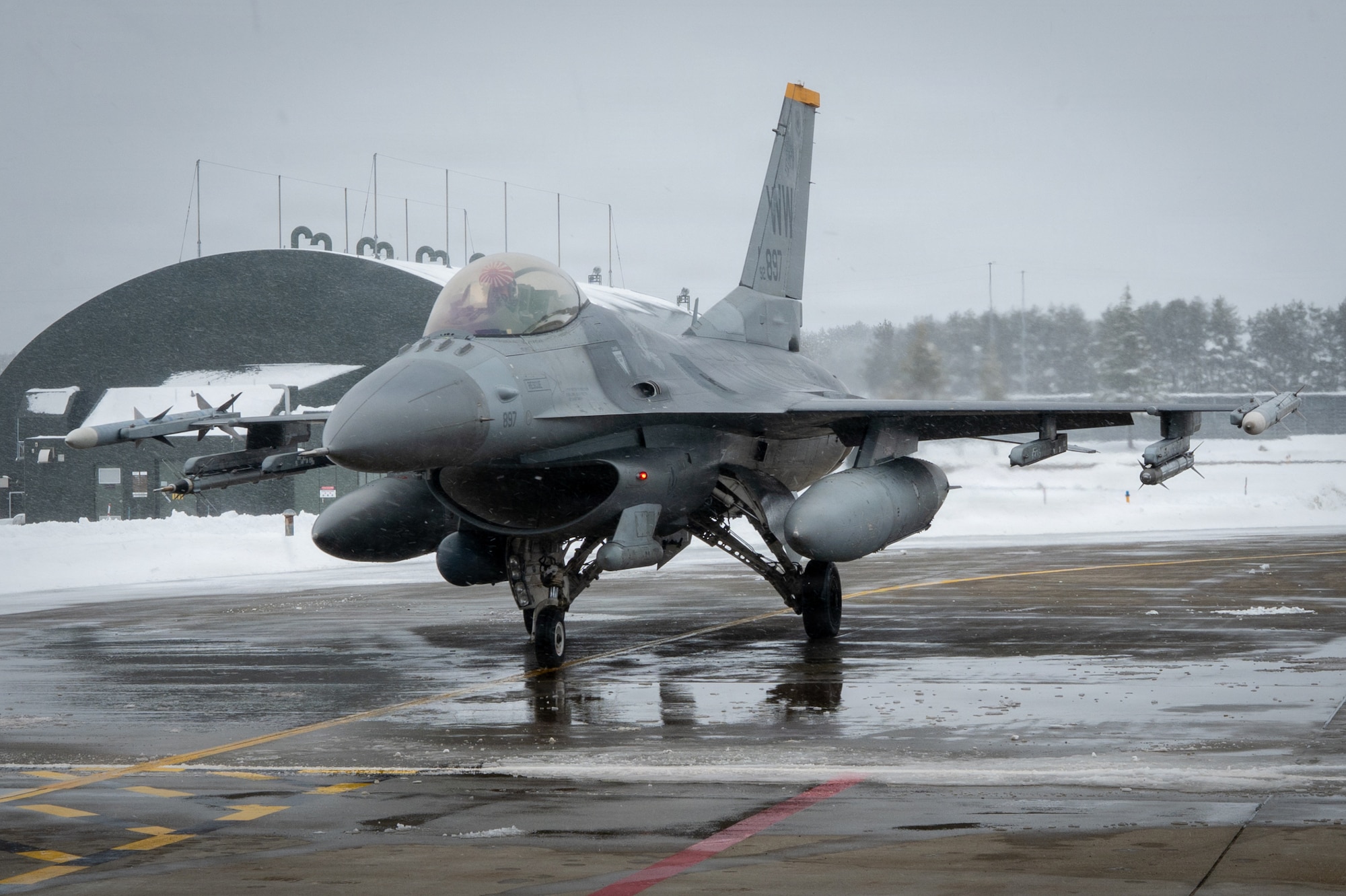 A U.S. Air Force F-16 Fighting Falcon assigned to the 14th Fighter Squadron taxis toward a   flight line refueling point at Misawa Air Base, Japan, Jan. 15, 2026.