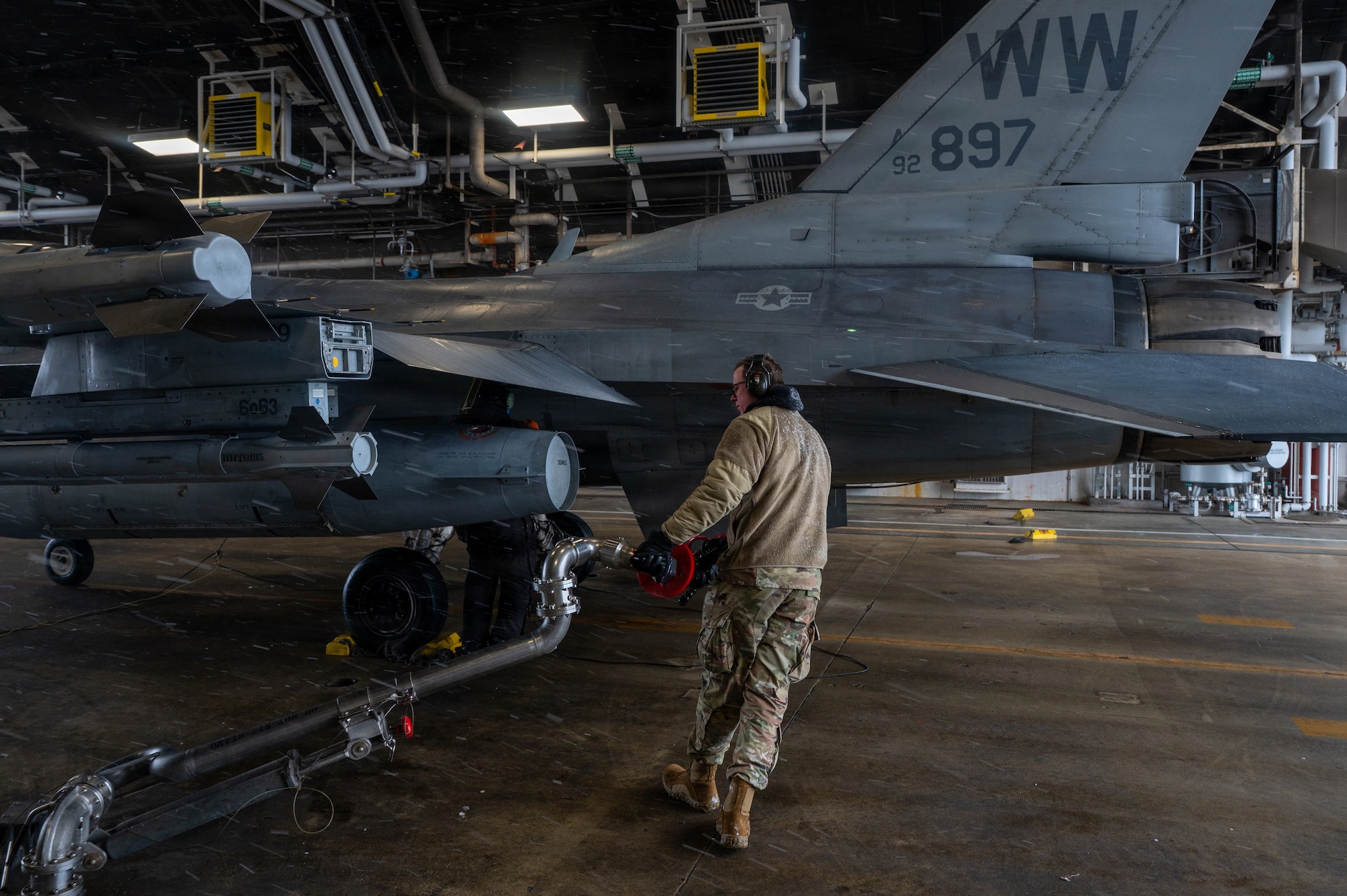 U.S. Air Force Airman 1st Class Cameron Hall, 35th Logistics Readiness Squadron fuels distribution operator, moves a pantograph to refuel an  F-16 Fighting Falcon at Misawa Air Base, Japan, Jan. 15, 2026.