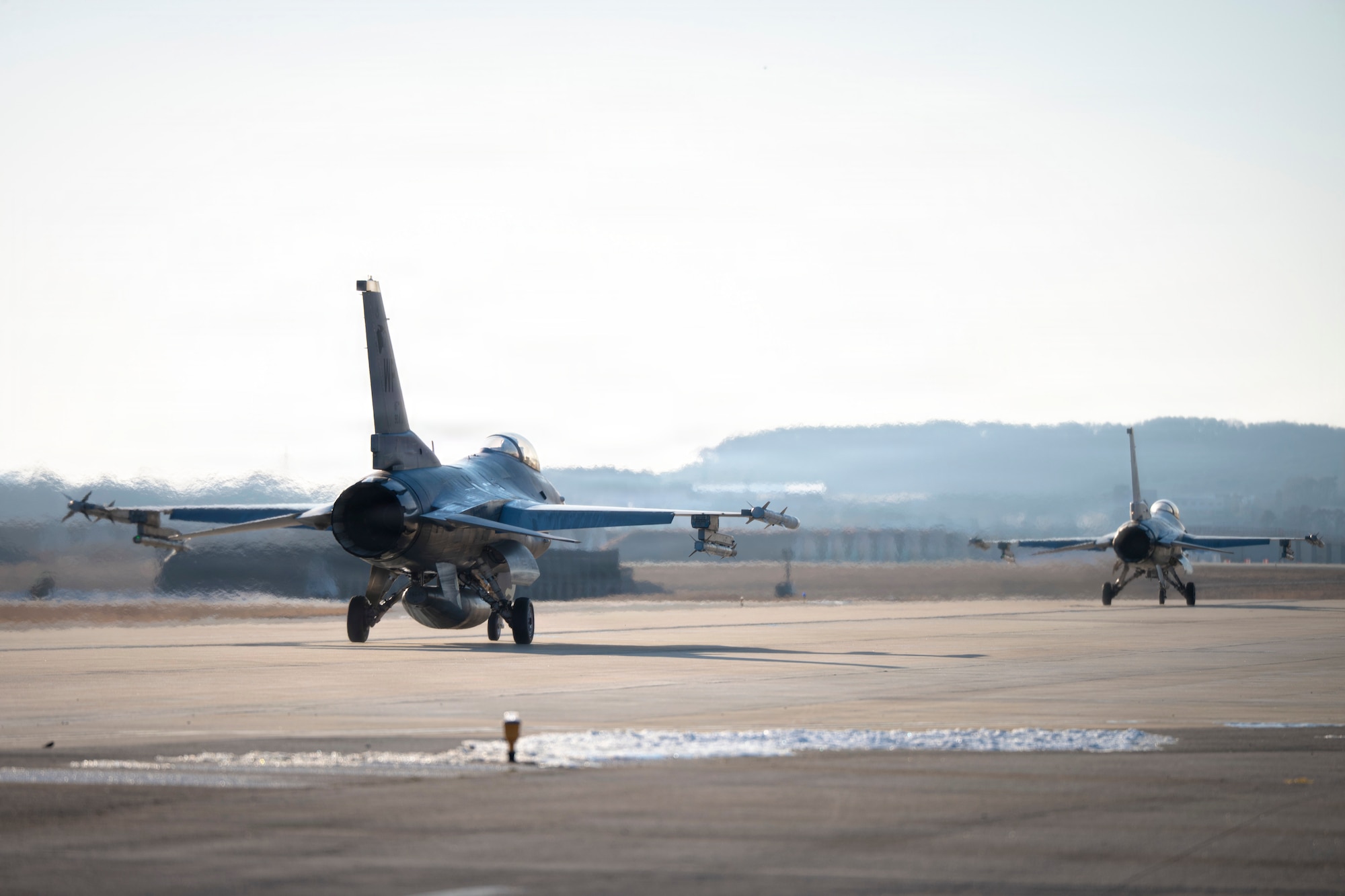U.S. Air Force F-16 Fighting Falcons assigned to the 35th Fighter Squadron taxi to the runway during a flying surge at Osan Air Base, Republic of Korea, Jan. 28, 2026.