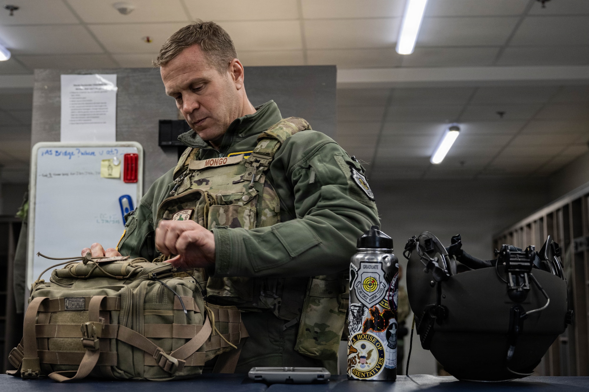 Col. Kingry prepares to fly in a helicopter.