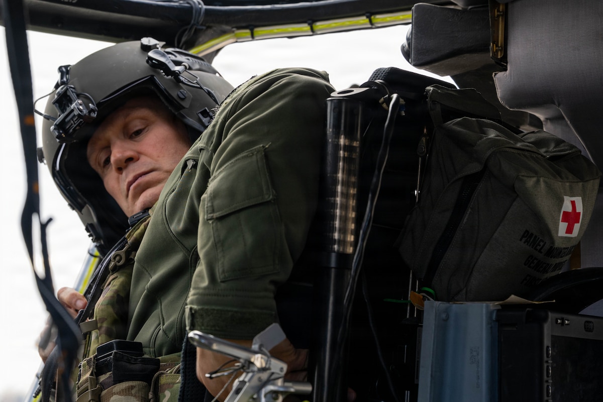 Col. Kingry prepares to fly in a helicopter.