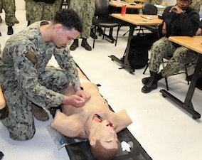 PATUXENT RIVER, Md – (January 28, 2026) – U.S. Navy Hospital Corpsman 3rd Class Miguel Rodriguez, assigned to the Medical Readiness Clinic at Navy Medicine Readiness and Training Command Patuxent River practices performing a needle chest decompression on a training mannequin during the Respiration Module of a Warrior Wednesday Lunch and Learn training. This hands-on training allows Sailors to build and maintain proficiency in critical, life-saving medical interventions for battlefield emergencies.