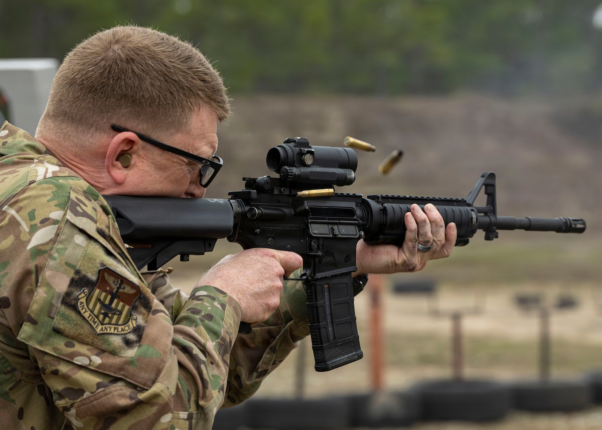 Col. Mark Hamilton, 1st Special Operations Wing commander, fires an M4 carbine during combat arms training and maintenance qualification at Hurlburt Field, Fla., Jan. 9, 2026. Senior leaders train alongside Airmen to reinforce core skills and readiness required to sustain the wing’s mission. (U.S. Air Force photo by Airman 1st Class Isabel Tanner)
