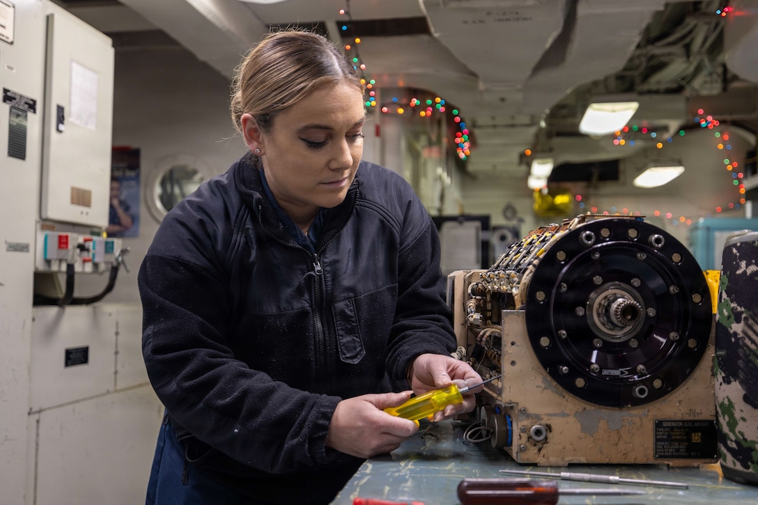 U.S. CENTRAL COMMAND AREA OF RESPONSIBILITY (Jan. 26, 2026) U.S. Navy Aviation Electrician’s Mate Airman Shelby Hard conducts maintenance on a generator converter unit for an F/A-18E aboard the Nimitz-class aircraft carrier USS Abraham Lincoln (CVN 72) in the U.S. Central Command (CENTCOM) area of responsibility, Jan. 26. Abraham Lincoln is deployed to the U.S. 5th Fleet area of operations to support maritime security and stability in the CENTCOM area of responsibility. (U.S. Navy photo by Mass Communication Specialist Seaman Hannah Tross)