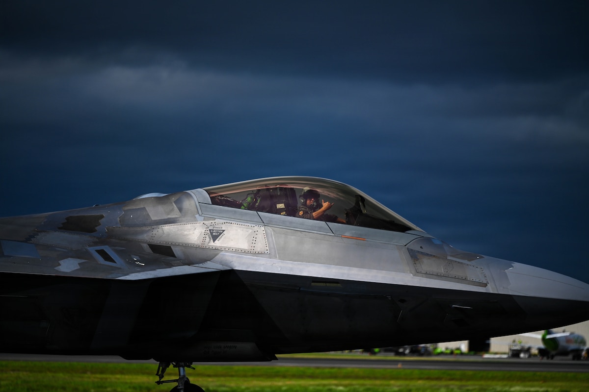 An F-22 Raptor assigned to the Hawaii Air National Guard taxis at Daniel K. Inouye International Airport, Hawaii, Jan. 14, 2026, during exercise Sentry Aloha. The exercise provides realistic fighter training and integration opportunities to support homeland defense and overseas missions. (U.S. Air Force photo by Staff Sgt. Mark Sulaica)
