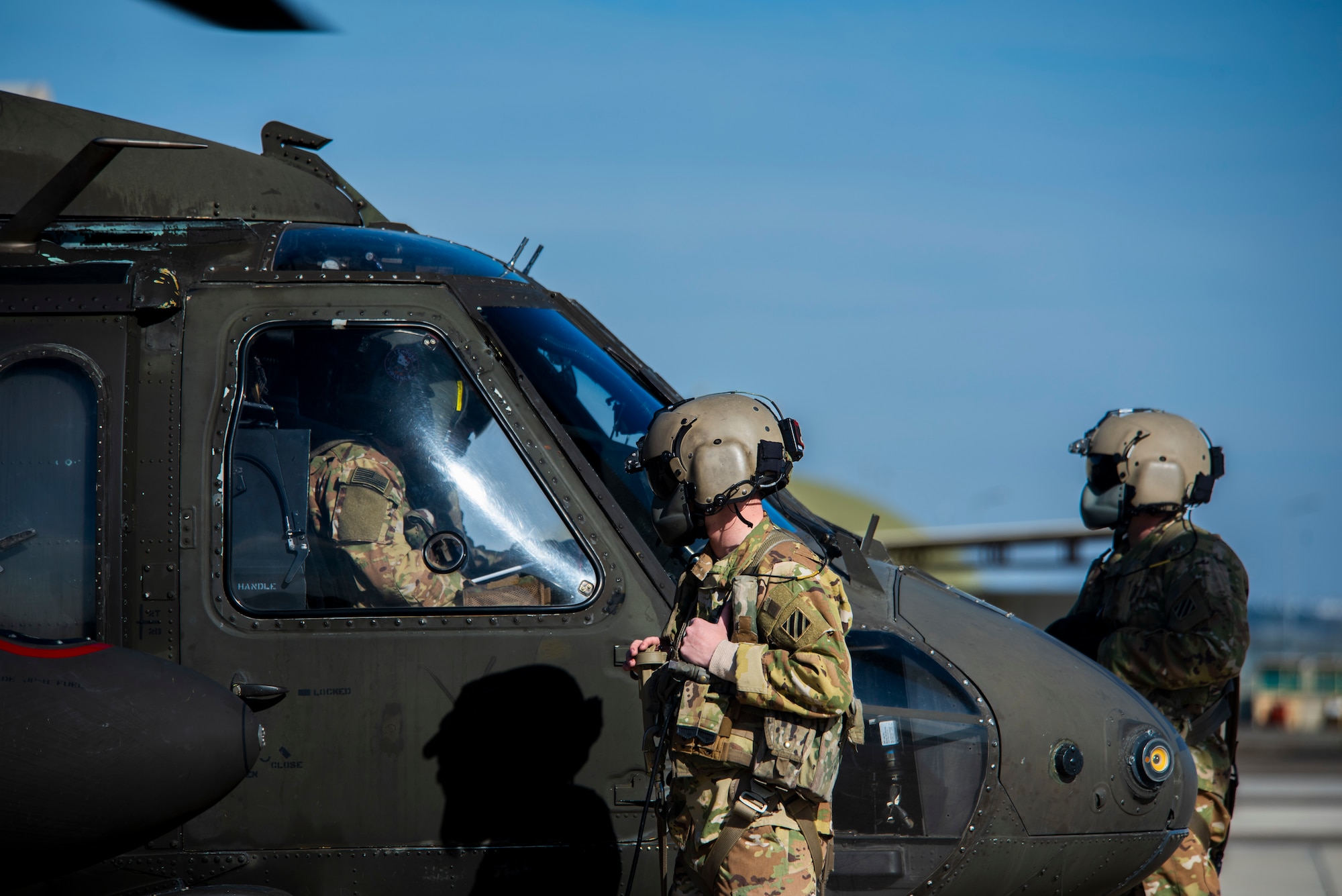 U.S. Army Soldiers prepare a UH-60 Black Hawk helicopter
