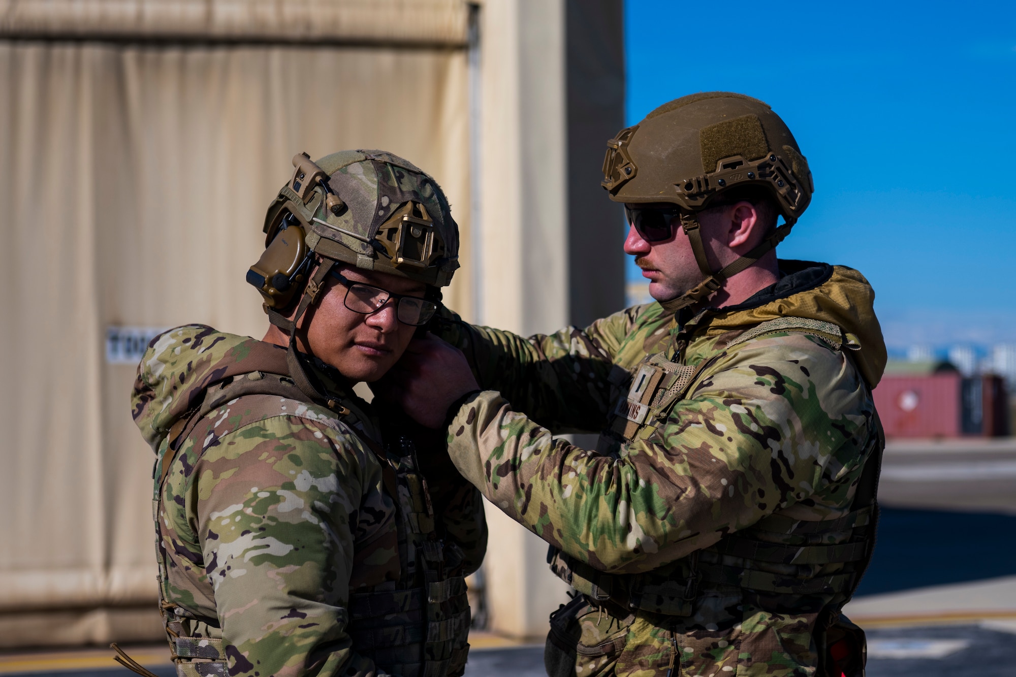 U.S. Airmen adjust flight gear