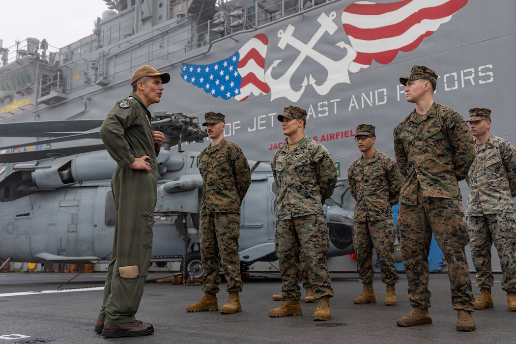 U.S. Navy Rear Adm. Carlos Sardiello, commander, U.S. Naval Forces Southern Command/U.S. Fourth Fleet, recognizes U.S. Marines with the 22nd Marine Expeditionary Unit (Special Operations Capable) during a visit to Wasp-class amphibious assault USS Iwo Jima (LHD 7) in Naval Station Mayport, Florida, Jan. 8, 2026. U.S. military forces are deployed to the Caribbean in support of the U.S. Southern Command mission, Department of War-directed operations, and the president’s priorities to disrupt illicit drug trafficking and protect the homeland. (U.S. Marine Corps photo)