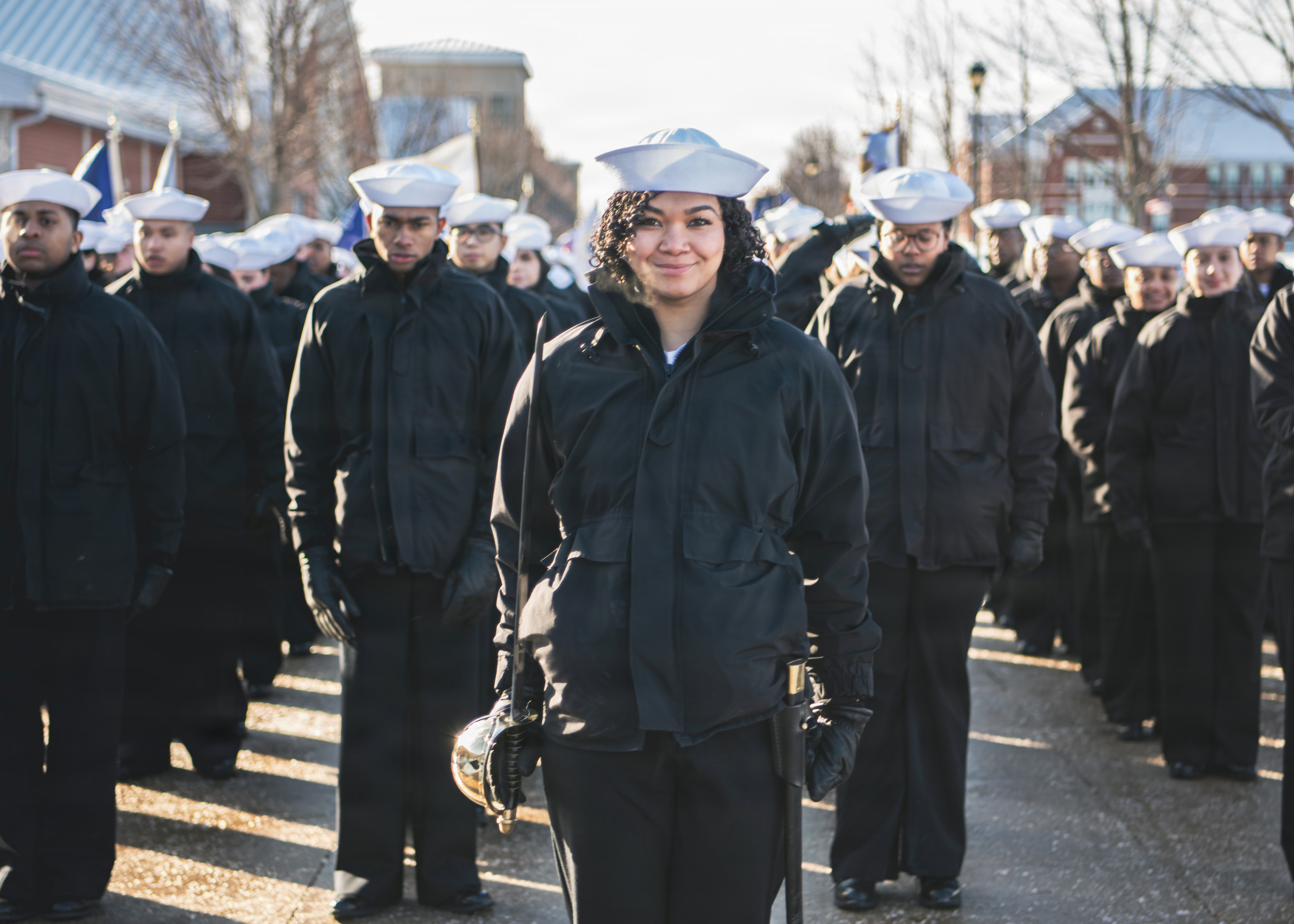 Sailors at U.S. Navy Recruit Training Command (RTC) in Great Lakes prepare to march into Midway Ceremonial Drill Hall for a pass-in-review. All Navy enlistees begin their nine-week career training here. Over 40,000 recruits train annually at the Navy’s only boot camp.