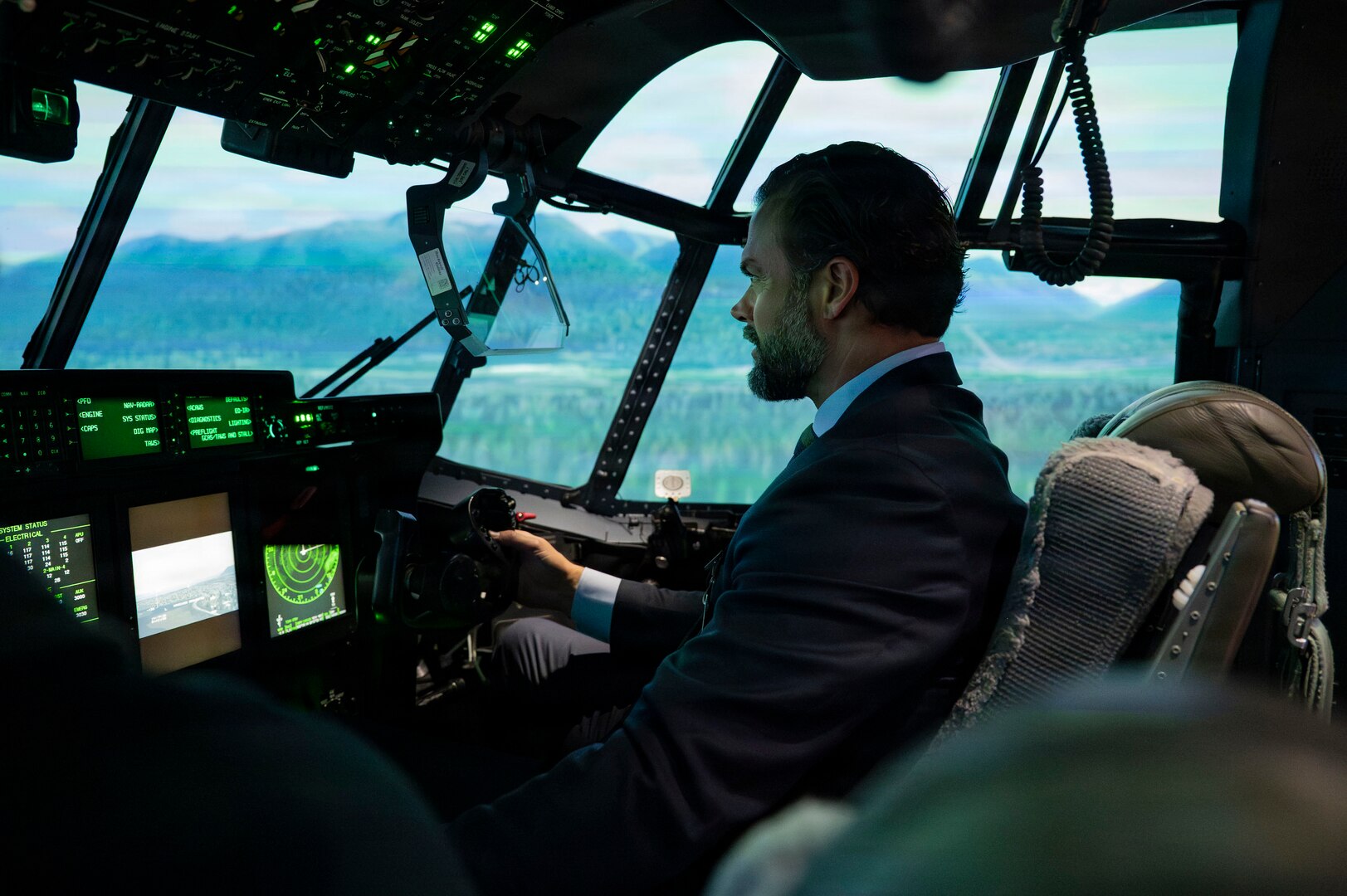 Matt Lohmeier takes control of an HC-130J Combat King II aircraft simulator