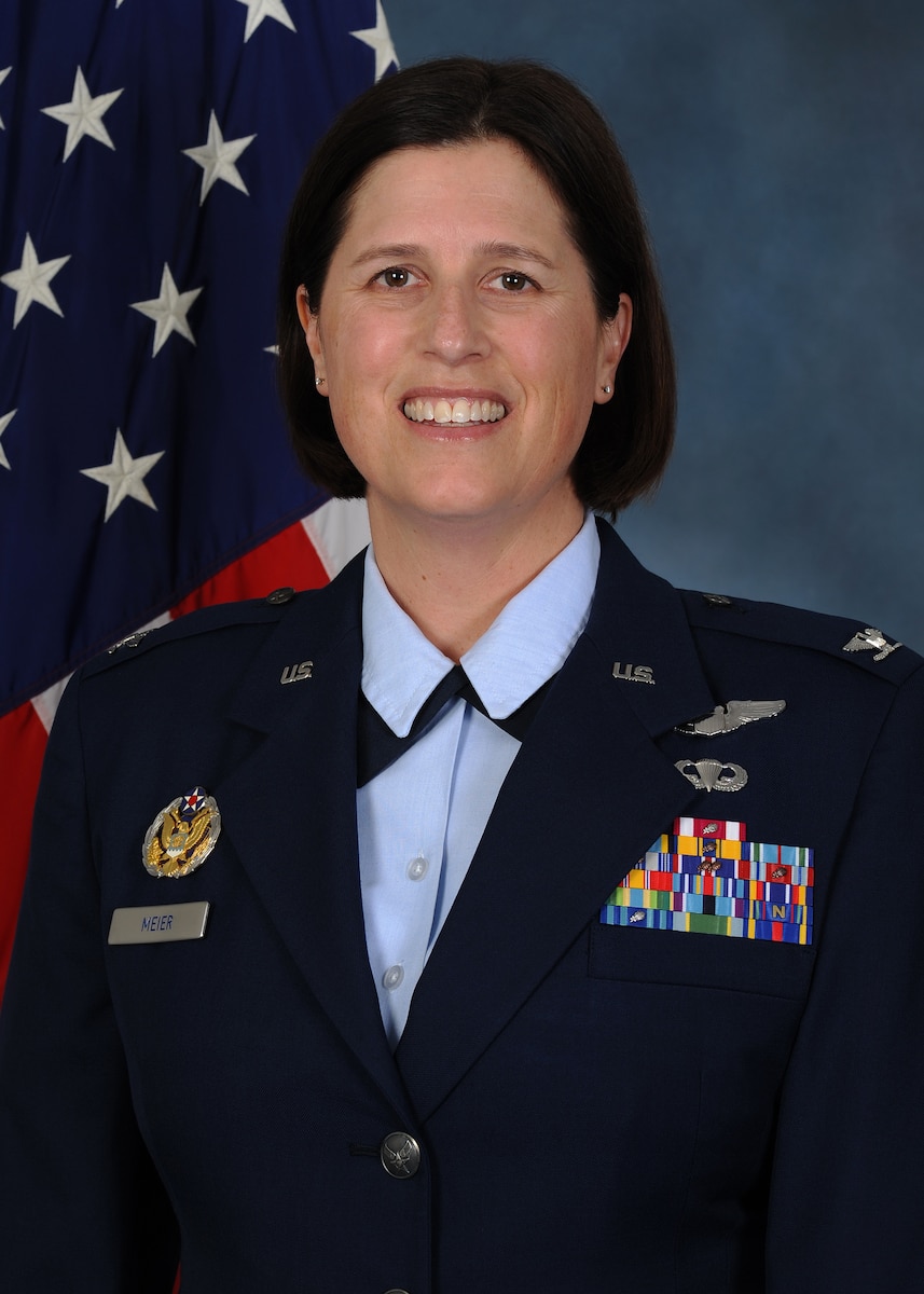 a person poses for an official photo