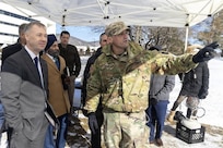 Chief Warrant Officer 3 Robert Reed, right, of the Pennsylvania National Guard Unmanned Aircraft Systems Training and Innovation Facility takes part an unmanned aircraft systems demonstration for Assistant Secretary of the Army for Acquisition, Logistics, and Technology and Army Acquisition Executive Brent Ingraham, left, Jan. 20, 2026, at Picatinny Arsenal, New Jersey.