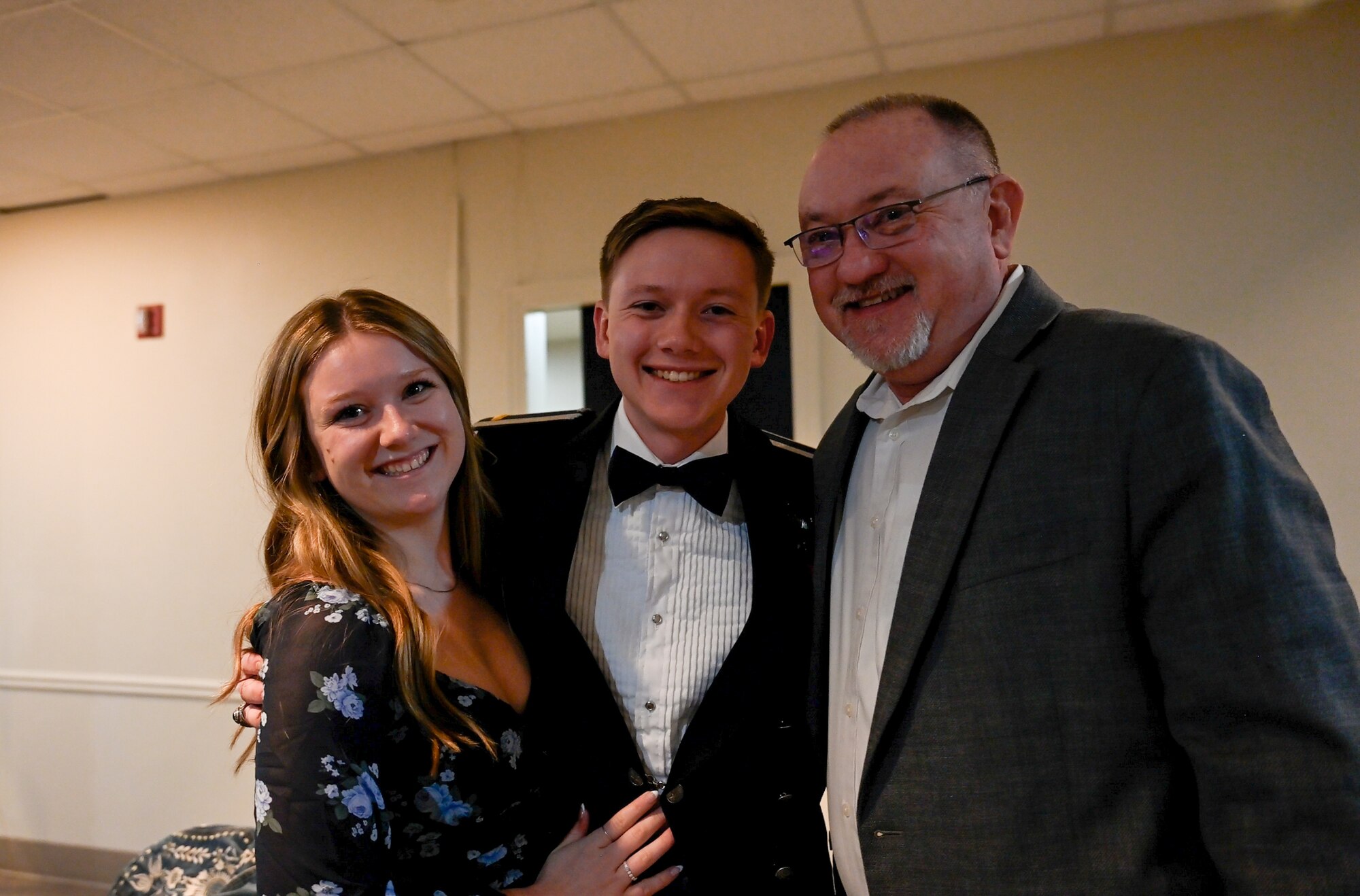 U.S. Air Force Airmen from graduating Class 26-05 present one half of their broken wings to their loved ones at Laughlin Air Force Base, Texas, Jan. 29, 2026.  Twenty-nine U.S. and Romanian Air Force officers were awarded silver wings during the ceremony, symbolizing their completion of the Undergraduate Pilot Training program. (U.S. Air Force photo by Airman 1st Class Harrison Sullivan)