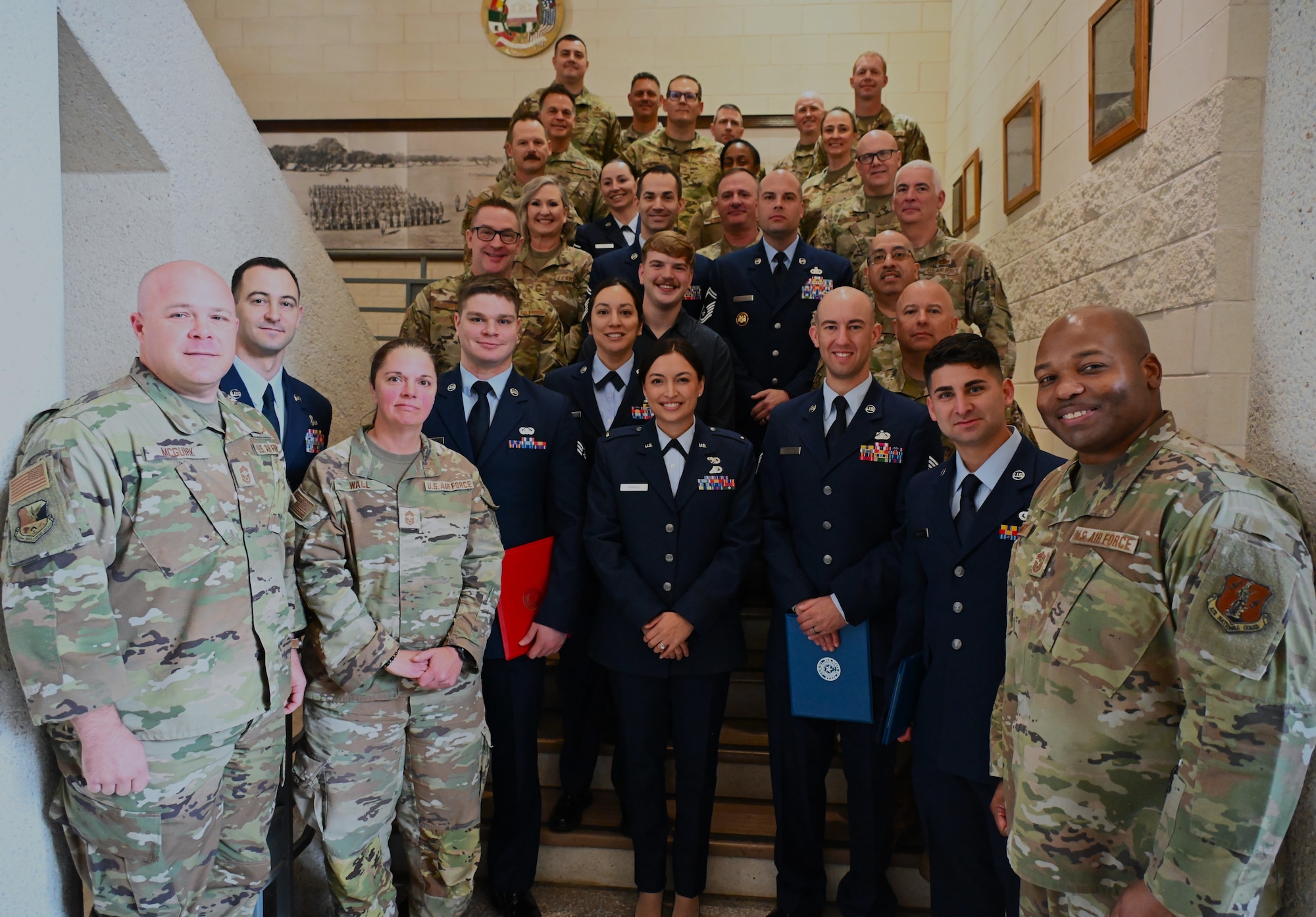 Air National Guard members from the 136th Airlift Wing standing together in a stairwell at Camp Mabry, Austin, Texas, Jan. 11, 2026.