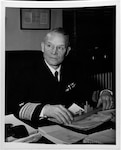 Vice Admiral Emory S. Land, USN, seated at his desk. (U.S. Navy photo, Naval History and Heritage Command)