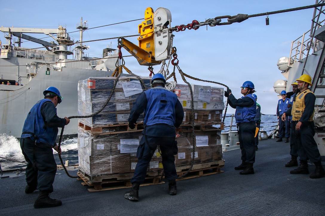 U.S. CENTRAL COMMAND AREA OF RESPONSIBILITY (Jan. 26, 2026) U.S. Sailors receive cargo aboard Arleigh Burke-class guided-missile destroyer USS Frank E. Petersen Jr. (DDG 121) during a replenishment-at-sea with Henry J. Kaiser-class fleet replenishment oiler USNS Henry J. Kaiser (T-AO-187) in the U.S. Central Command (CENTCOM) area of responsibility. Frank E. Petersen Jr. is deployed to the U.S. 5th Fleet area of operations to support maritime security and stability in the CENTCOM area of responsibility. (U.S. Navy photo by Mass Communication Specialist 2nd Class Christian Kibler)