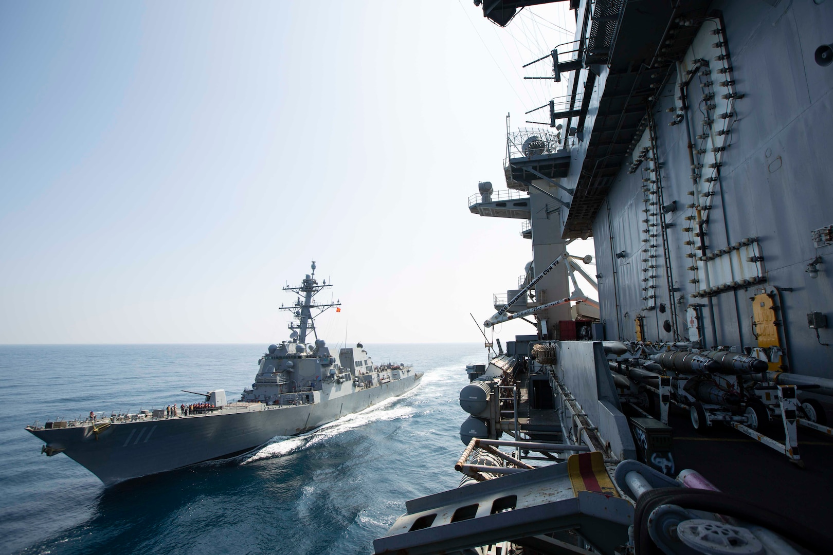 U.S. CENTRAL COMMAND AREA OF RESPONSIBILITY (Nov. 14, 2024) The Nimitz-class aircraft carrier USS Abraham Lincoln (CVN 72) sails alongside the Arleigh Burke-class guided-missile destroyer USS Spruance (DDG 111) in the U.S. 5th Fleet area of operations. (Official U.S. Navy photo)