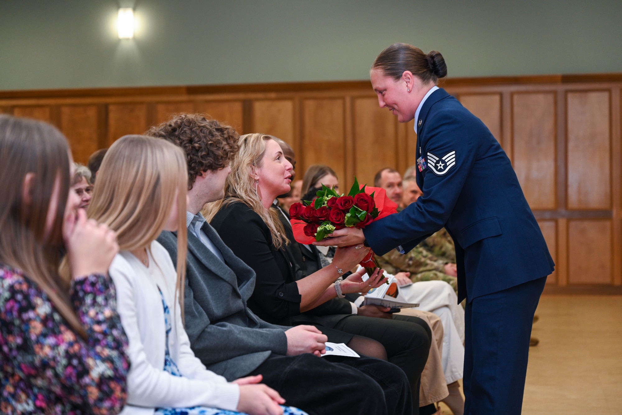 A family is given flowers.