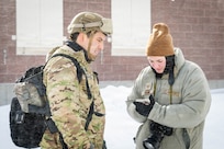 U.S. Air Force Tech. Sgt. Wynndermere Shaw, a public affairs specialist with the 182nd Airlift Wing, Illinois Air National Guard, writes caption information during Northern Strike 26-1 Jan. 27, 2026, at Camp Grayling, Michigan. Northern Strike 26-1 is a Joint National Training Capability accredited, Army-sponsored, National Guard Bureau program.
