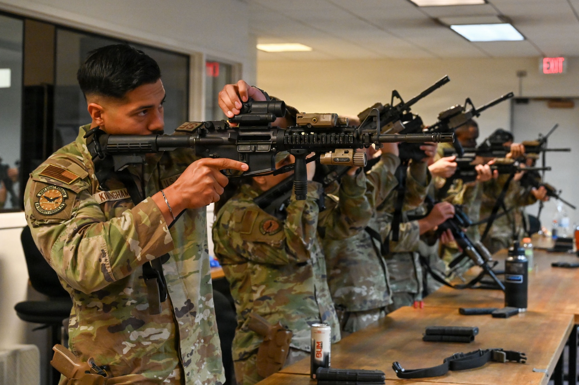 a person holds a rifle and looks through the sight