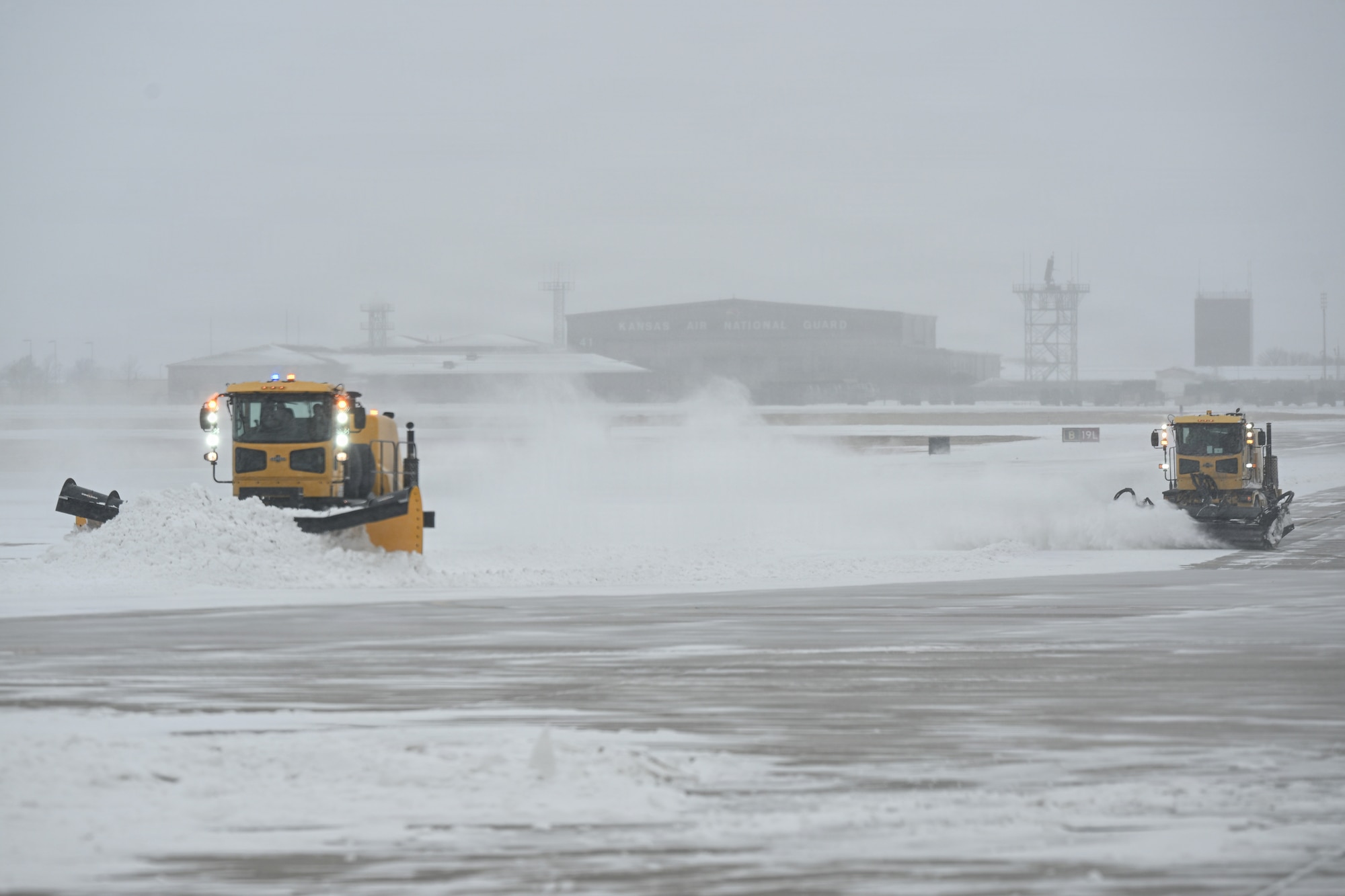 Airmen assigned to the 22nd Civil Engineer Squadron plow snow at McConnell Air Force Base, Kansas, Jan. 24., 2026.  CE members cleared the airfield to reduce snow accumulation and restore normal operations. (U.S. Air Force photo by Senior Airman Amelio Brown)