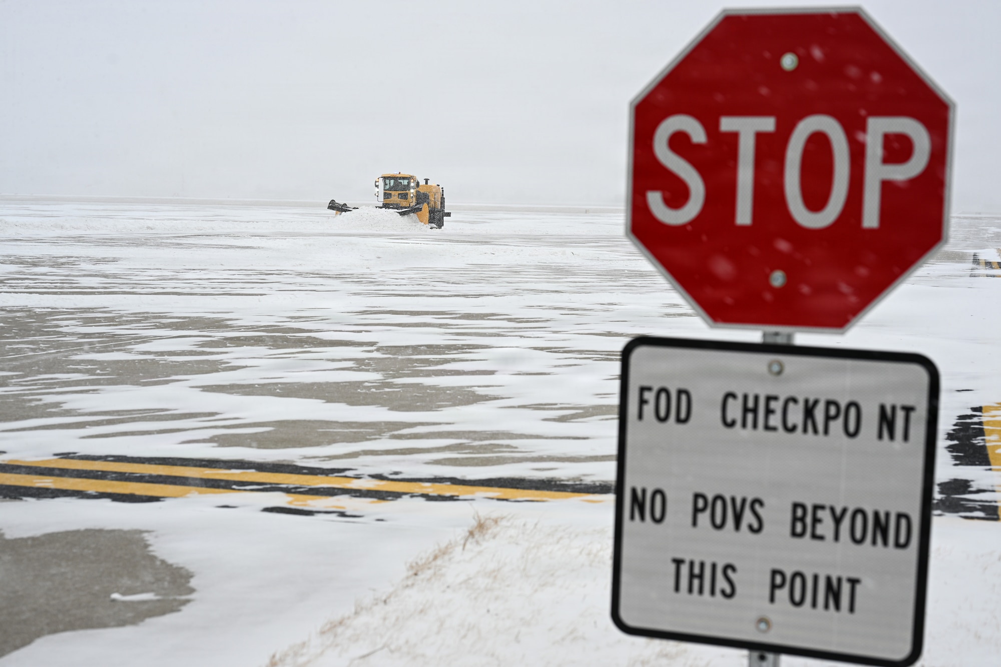 Airmen assigned to the 22nd Civil Engineer Squadron plow snow at McConnell Air Force Base, Kansas, Jan. 24., 2026.  CE members cleared the airfield to reduce snow accumulation and restore normal operations. (U.S. Air Force photo by Senior Airman Amelio Brown)