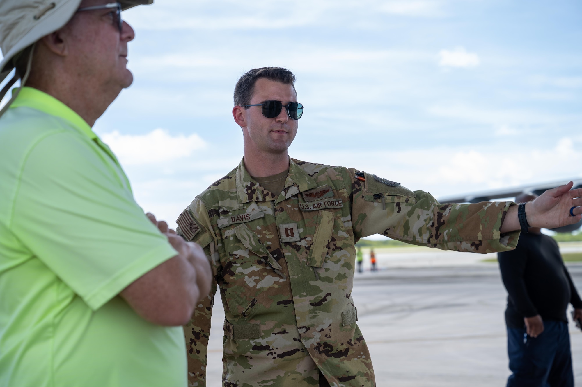 U.S. Air Force Capt. Pete Davis, 39th Airlift Squadron pilot, answers questions about the capabilities of a C-130J Super Hercules during a static display and community engagement event as part of Exercise Palmetto Reach at Saipan International Airport, Jan. 20, 2026. Community engagement events strengthen relationships with local communities while increasing awareness of U.S. Air Force mobility capabilities. (U.S. Air Force photo by Airman 1st Class Adrien Tran)