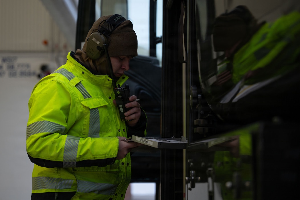 U.S. Air Force Airman 1st Class Timothy King, 354th Logistics Readiness Squadron fuels distribution operator, writes a receipt for a crew chief at Eielson Air Force Base, Alaska, Jan. 26, 2026.