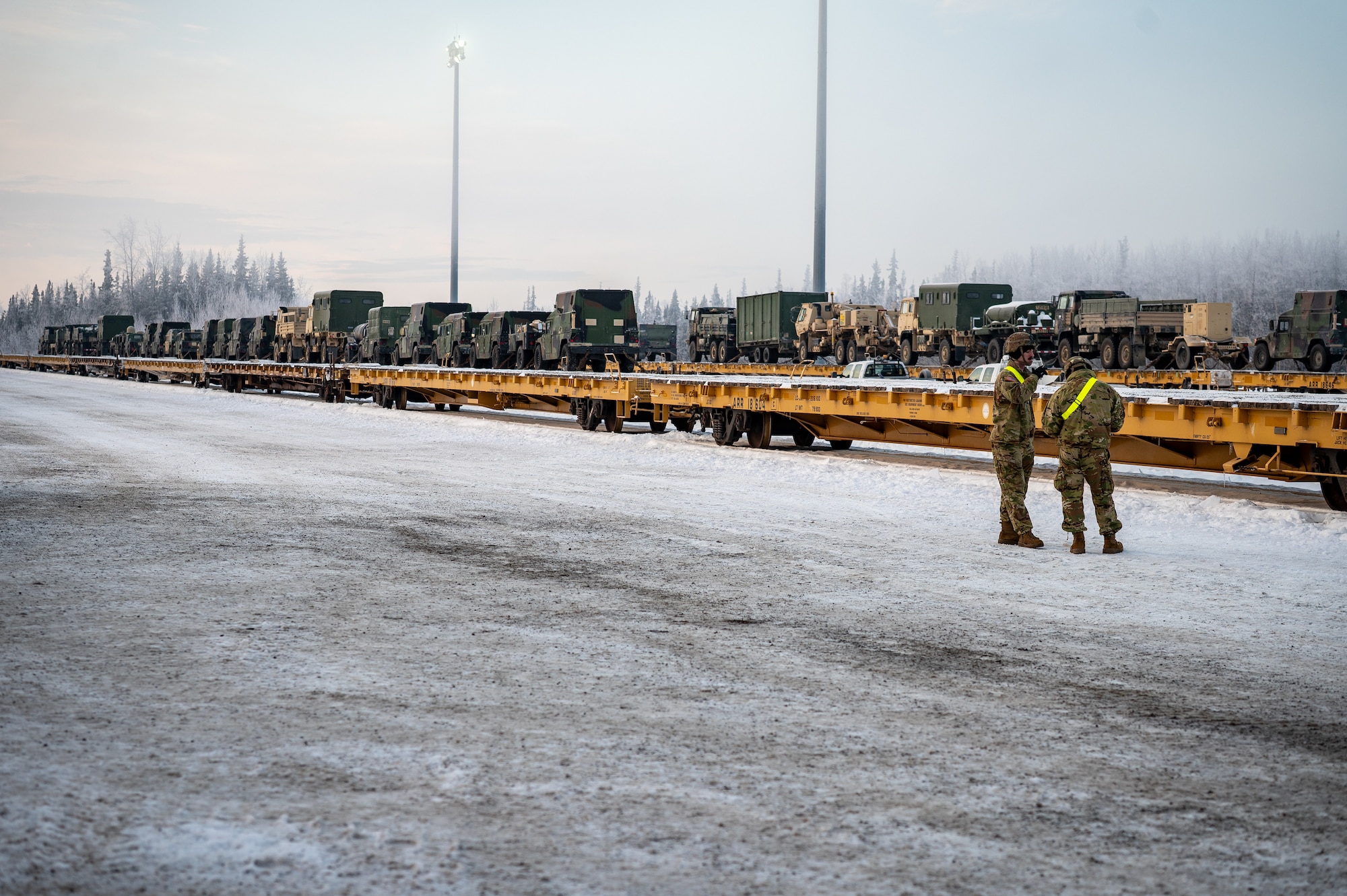 U.S. Army Pfc. Owen Pakkala and Spc. Alex Lawson, both 3rd Battalion, 509th Parachute Infantry Regiment, 11th Airborne Division infantrymen, assess freight at Joint Base Elmendorf-Richardson, Alaska, Jan. 22, 2026, for Joint Pacific Multinational Readiness Center 26-02. Exercise JPMRC provides realistic, high-end training that enhances readiness and interoperability across U.S. and partner forces. (U.S. Air Force photo by Senior Airman Hunter Hites)