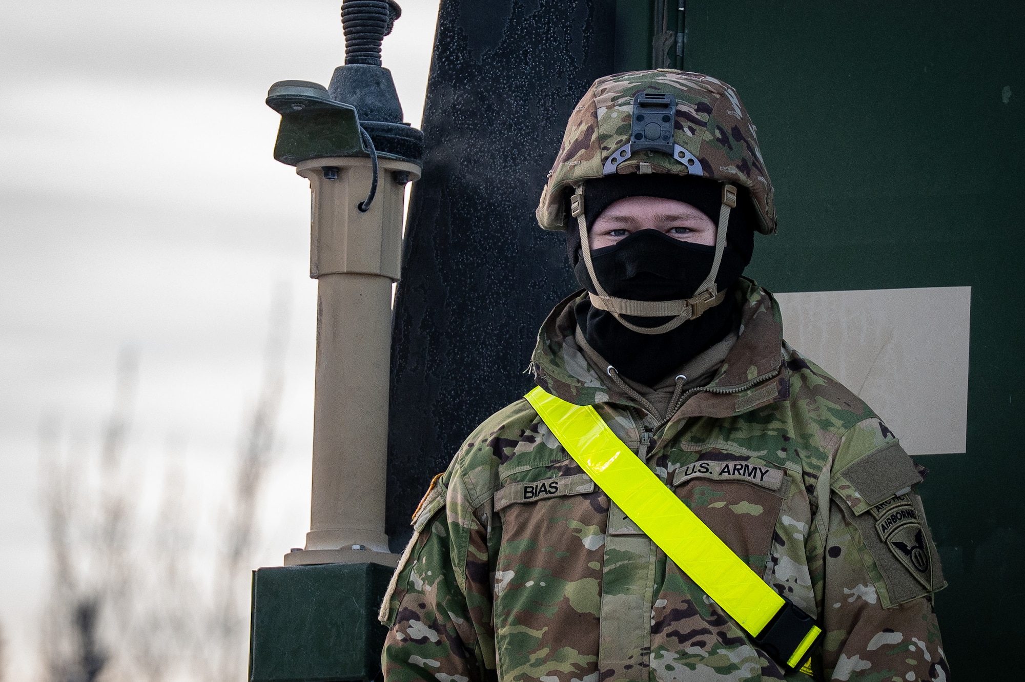 U.S. Army Pvt. Colby Bias, 3rd Battalion, 509th Parachute Infantry Regiment, 11th Airborne Division infantryman, awaits freight onto a flatcar at Joint Base Elmendorf-Richardson, Alaska, Jan. 22, 2026, for Joint Pacific Multinational Readiness Center 26-02. The exercise tests units’ ability to deploy, integrate and operate effectively across the Indo-Pacific region. (U.S. Air Force photo by Senior Airman Hunter Hites)