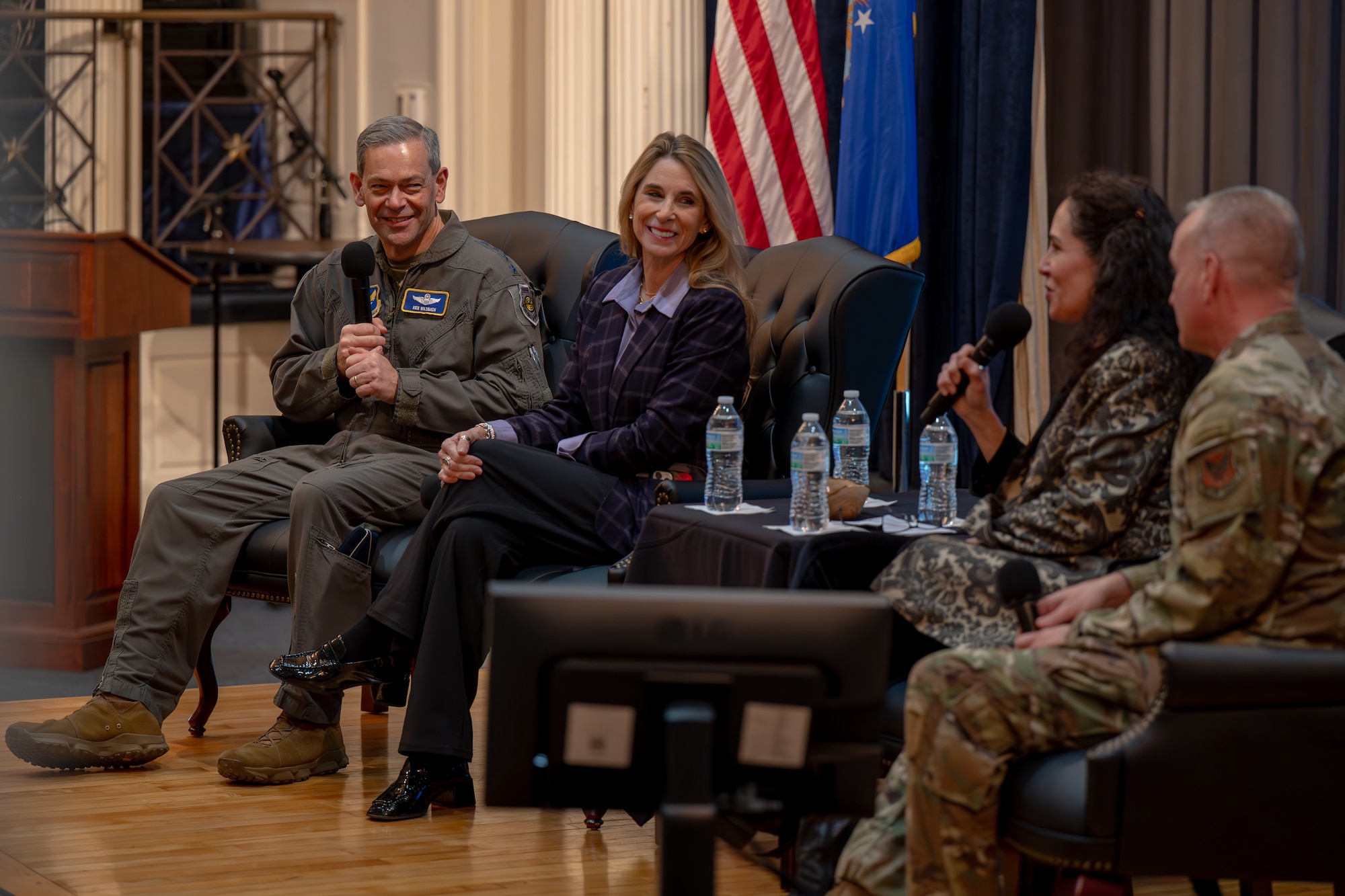 The CSAF, CMSAF and their wives speak at a panel.