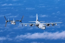 A U.S. Marine Corps MV-22B Osprey assigned to Marine Medium Tiltrotor Squadron (VMM) 268, Marine Aircraft Group 24, 1st Marine Aircraft Wing, flies alongside a KC-130J assigned to Marine Aerial Refueler Transport Squadron 153 during a flight over the Pacific Ocean, Jan 27, 2026.