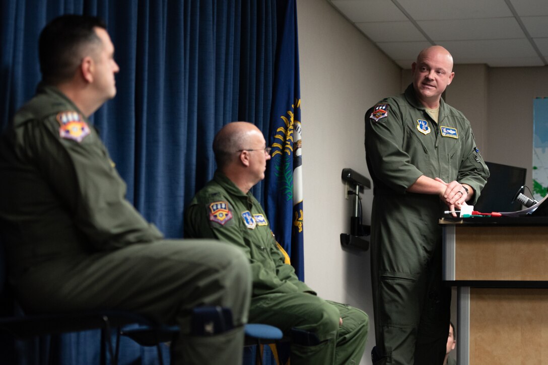 Lt. Col. Josh Ketterer, incoming commander of the 123rd Operations Group, speaks during the unit’s change-of-command ceremony at the Kentucky Air National Guard Base in Louisville, Ky., Dec. 14, 2025. Ketterer replaces Col. Randall Hood, who has been named deputy commander of the 123rd Airlift Wing. (U.S. Air National Guard photo by Tech. Sgt. Chloe Ochs)
