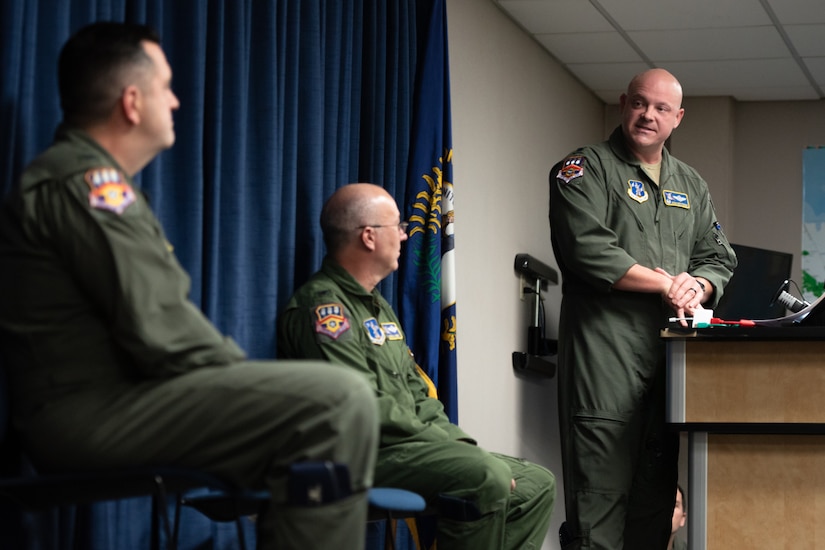 Lt. Col. Josh Ketterer, incoming commander of the 123rd Operations Group, speaks during the unit’s change-of-command ceremony at the Kentucky Air National Guard Base in Louisville, Ky., Dec. 14, 2025. Ketterer replaces Col. Randall Hood, who has been named deputy commander of the 123rd Airlift Wing. (U.S. Air National Guard photo by Tech. Sgt. Chloe Ochs)