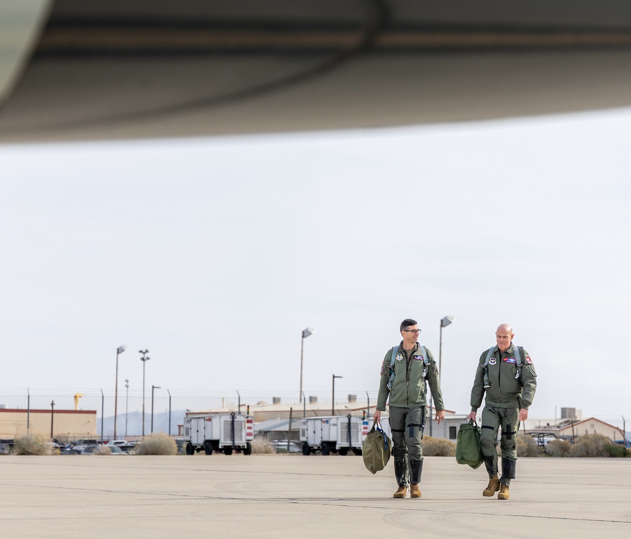 Lt. Gen. Clark Quinn, Air Education and Training Command commander,  and Lt. Col. Jonathan Aronoff, 416th Flight Test Squadron T-7 lead test pilot, walk toward a T-7 Red Hawk.