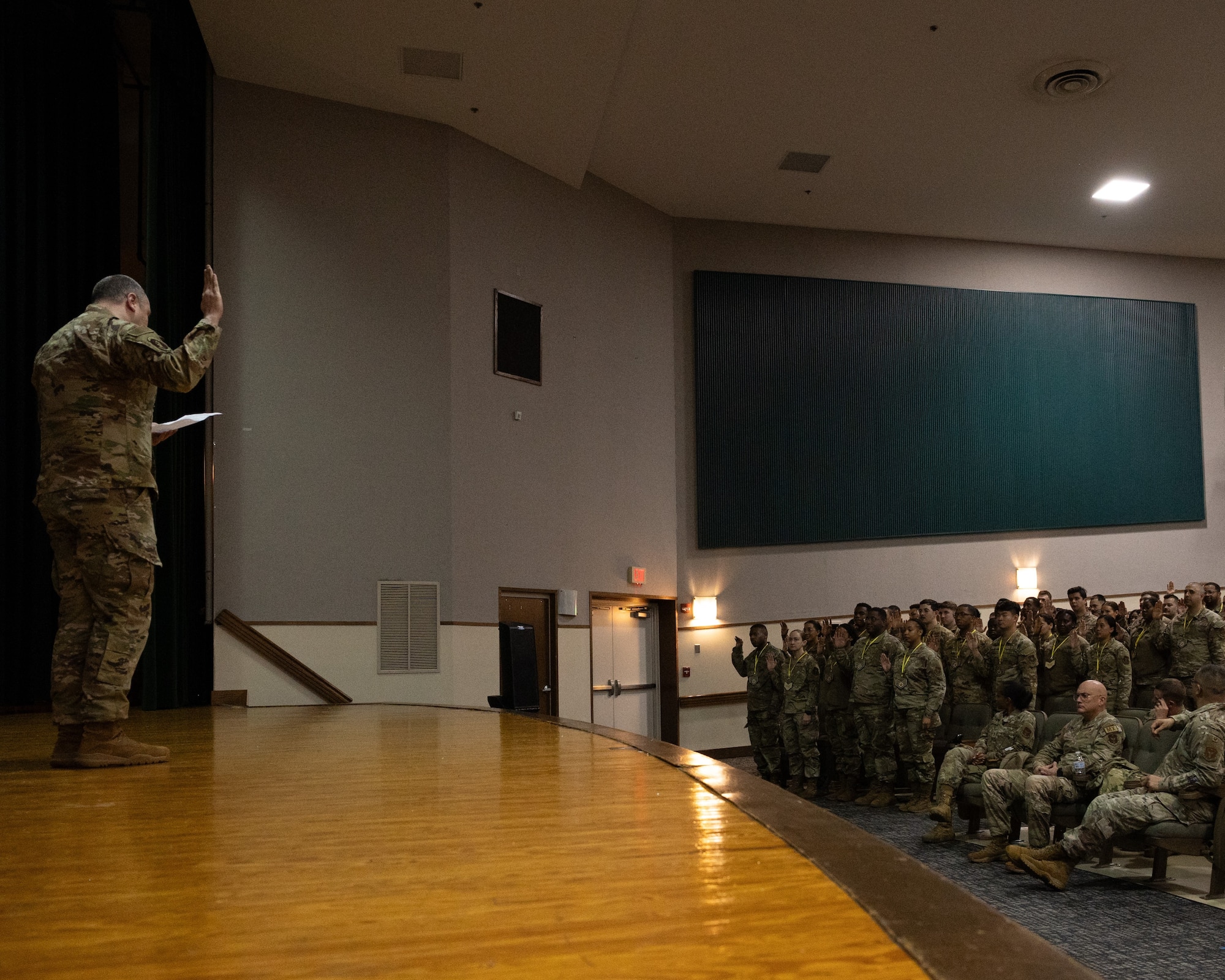 Airmen from the 459th ARW raise their right hands as they recite the official NCO charge during the wing's NCO Induction Ceremony held at the 459th during its January UTA weekend. (U.S. Air Force photo by Senior Airman Alexcia Givens).