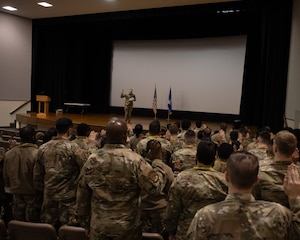 Airmen from the 459th ARW raise their right hands as they recite the official NCO charge during the wing's NCO Induction Ceremony held at the 459th during its January UTA weekend. (U.S. Air Force photo by Senior Airman Alexcia Givens).