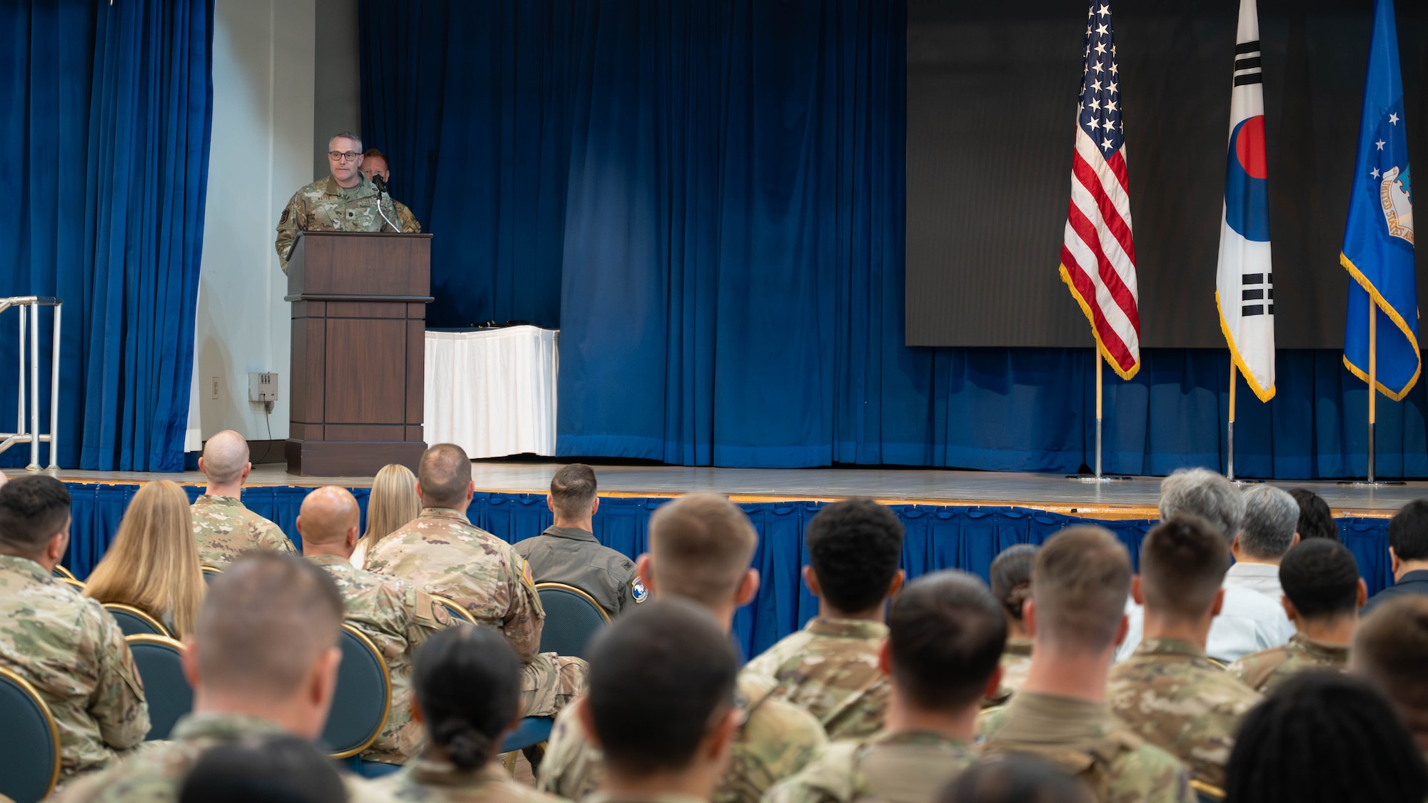 U.S. Air Force Lt. Col. Shane Watts, incoming 51st Security Forces Squadron commander, delivers remarks during a change of command ceremony at Osan Air Base, Republic of Korea, June 26, 2026. The ceremony recognized the official transition of leadership within the 51st Security Forces Squadron. (U.S. Air Force photo by Senior Airman Megan Cusmano)