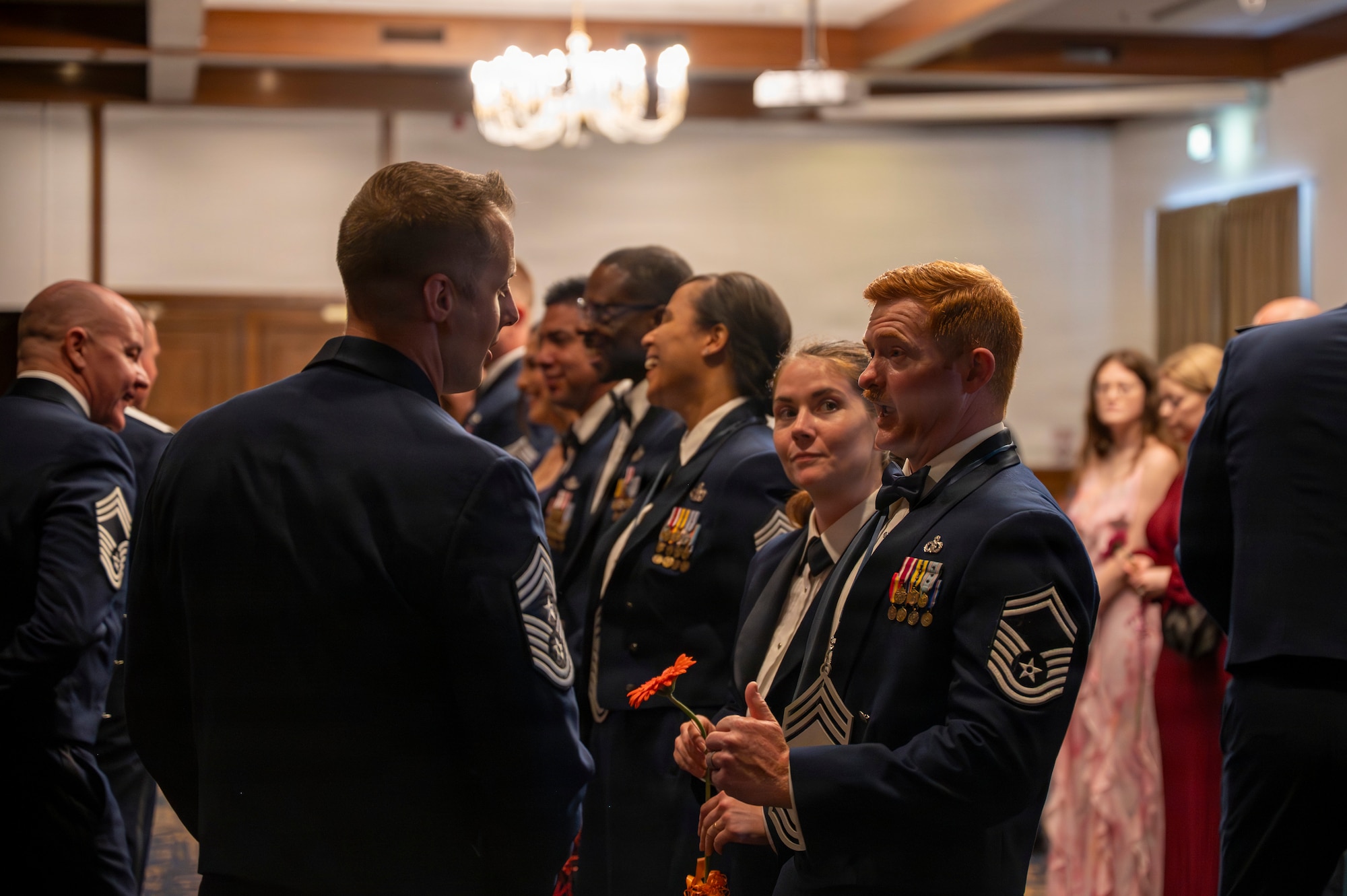A photo of Airman conversing during a ceremony