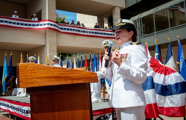 Capt. Elizabeth Adriano, outgoing director of Naval Medical Center San Diego (NMCSD), delivers remarks during the Navy Medicine Readiness and Training Command (NMRTC) San Diego change of command and NMCSD transfer of directorship ceremony at NMCSD, June 30, 2026. NMRTC San Diego supports Navy and Marine Corps readiness by ensuring its medical forces are ready to deploy and provide medical support, ashore or at sea. The mission of NMCSD is to optimize health and enhance readiness. NMCSD employs more than 5,500 active-duty military personnel, civilians, and contractors in southern California to deliver exceptional care afloat and ashore. (U.S. Navy photo by Mass Communication Specialist 1st Class Marcus Stanley)