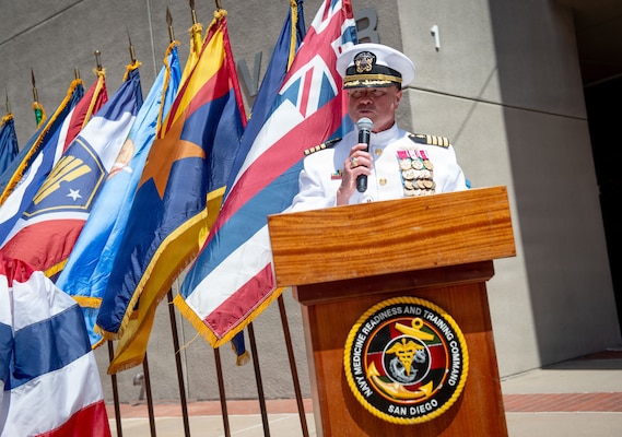 Capt. Jerry J. Bailey reads his orders before assuming the duties as director of Naval Medical Center San Diego (NMCSD) during the Navy Medicine Readiness and Training Command (NMRTC) San Diego change of command and NMCSD transfer of directorship ceremony at NMCSD, June 30, 2026. NMRTC San Diego supports Navy and Marine Corps readiness by ensuring its medical forces are ready to deploy and provide medical support, ashore or at sea. The mission of NMCSD is to optimize health and enhance readiness. NMCSD employs more than 5,500 active-duty military personnel, civilians, and contractors in southern California to deliver exceptional care afloat and ashore. (U.S. Navy photo by Mass Communication Specialist 1st Class Marcus Stanley)
