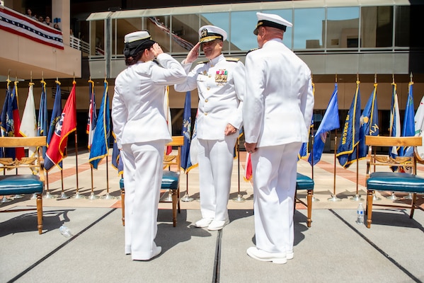 Rear Adm. Kevin J. Brown, commander, Naval Medical Forces Pacific, and director, Defense Health Network Pacific Rim, conducts the transfer of leadership between Capt. Elizabeth Adriano and Capt. Jerry J. Bailey during the Navy Medicine Readiness and Training Command (NMRTC) San Diego change of command and Naval Medical Center San Diego (NMCSD) transfer of directorship ceremony at NMCSD, June 30, 2026. The ceremony marked Bailey's assumption of duties as director of NMCSD, succeeding Adriano. NMRTC San Diego supports Navy and Marine Corps readiness by ensuring its medical forces are ready to deploy and provide medical support, ashore or at sea. The mission of NMCSD is to optimize health and enhance readiness. NMCSD employs more than 5,500 active-duty military personnel, civilians, and contractors in southern California to deliver exceptional care afloat and ashore. (U.S. Navy photo by Mass Communication Specialist 1st Class Marcus Stanley)